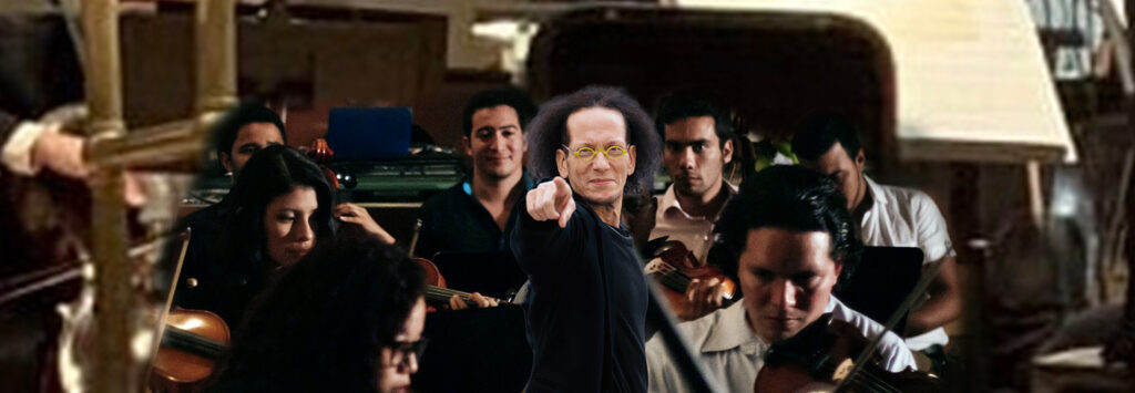 Conductor gestures dynamically in front of an orchestra, showcasing a collaborative musical performance. Musicians focus intently on their instruments.